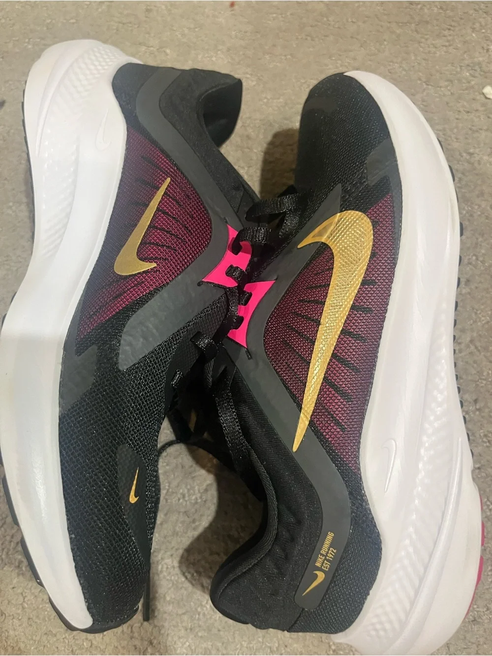 Nike Women’s Black/Purple Running Shoes with Gold Swoosh